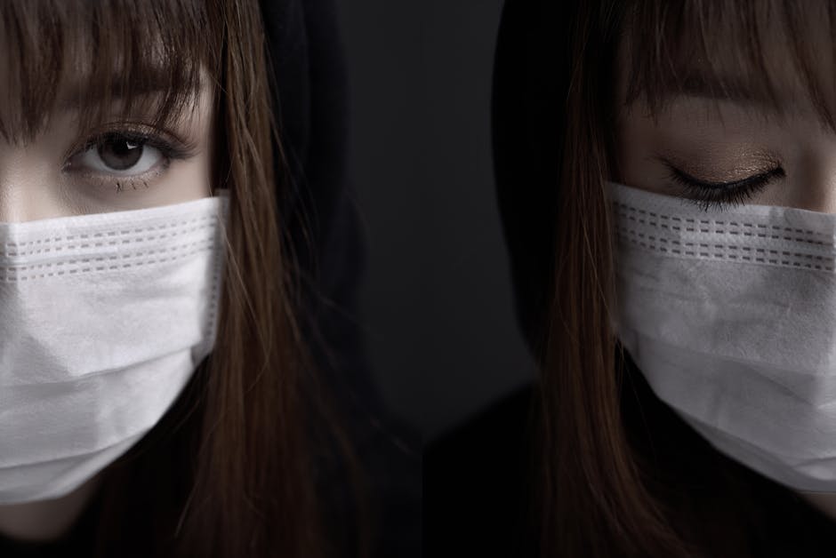 Close-up of a woman wearing a face mask against a dark background, evoking a sense of mystery.