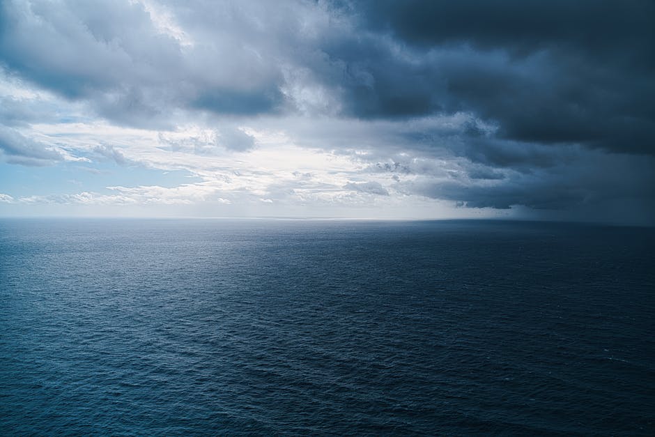 Breathtaking view of the ocean under dramatic clouds at sunset near Ponta do Pargo, Madeira.
